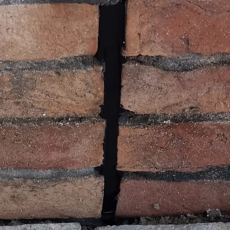 Close-up of a sealed movement joint through brickwork
